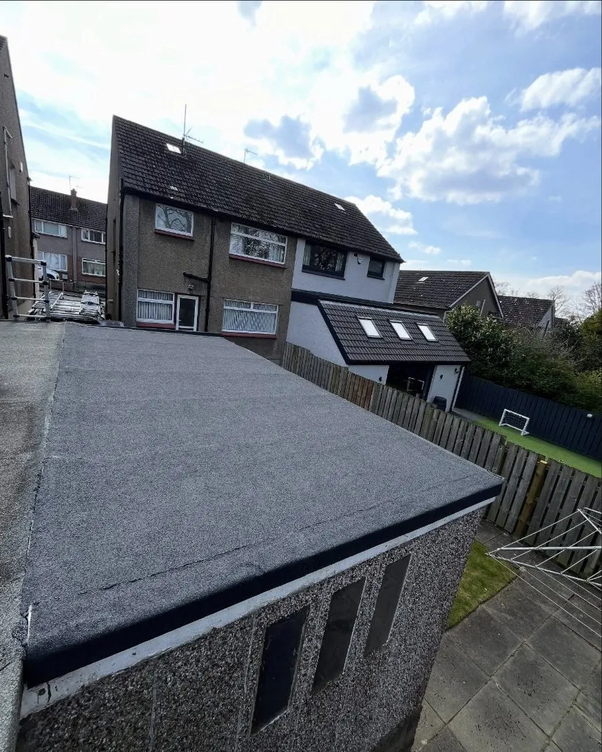 A finished torch-on felt flat roof on a rear extension