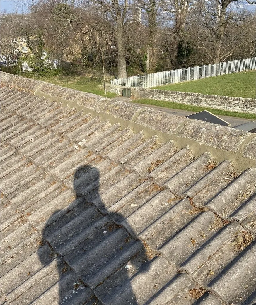 A repointed ridge running along a tiled roof